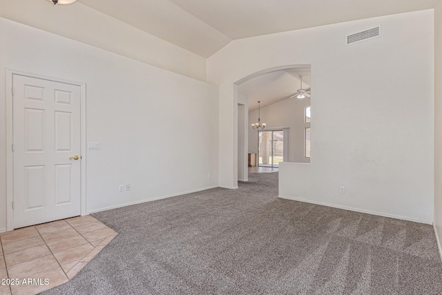 10318 E Plata Ave, Mesa, AZ 85212 - empty room with lofted ceiling, light colored carpet, arched walkways, a chandelier, and ceiling fan