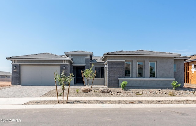 prairie-style house featuring a garage