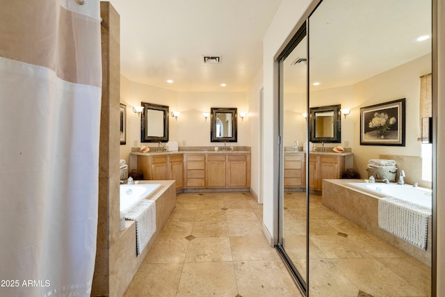 3538 E Squawbush Pl, Phoenix, AZ 85044 - bathroom featuring a garden tub, double vanity, and recessed lighting
