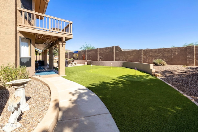 3538 E Squawbush Pl, Phoenix, AZ 85044 - fenced backyard featuring an area to practice putting, a patio area, and a balcony