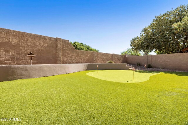 3538 E Squawbush Pl, Phoenix, AZ 85044 - fenced backyard featuring an area to practice putting