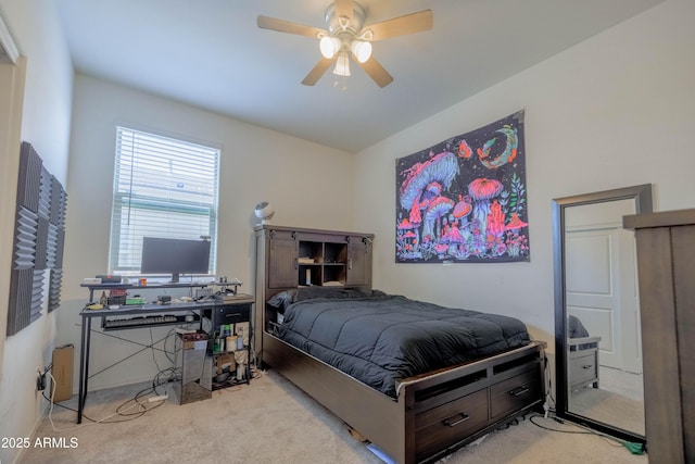 carpeted bedroom featuring a ceiling fan