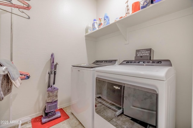 laundry room featuring baseboards, laundry area, and washer and dryer
