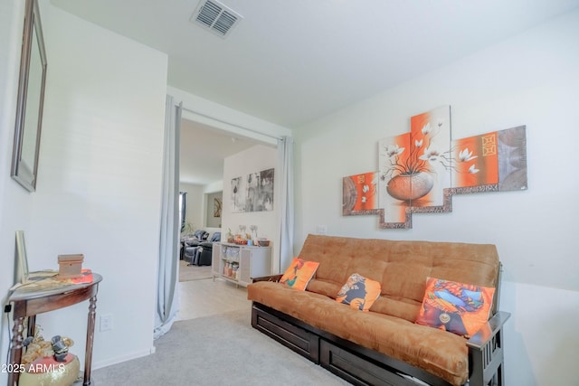 sitting room featuring carpet flooring and visible vents