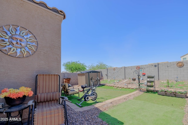 view of yard with a fenced backyard