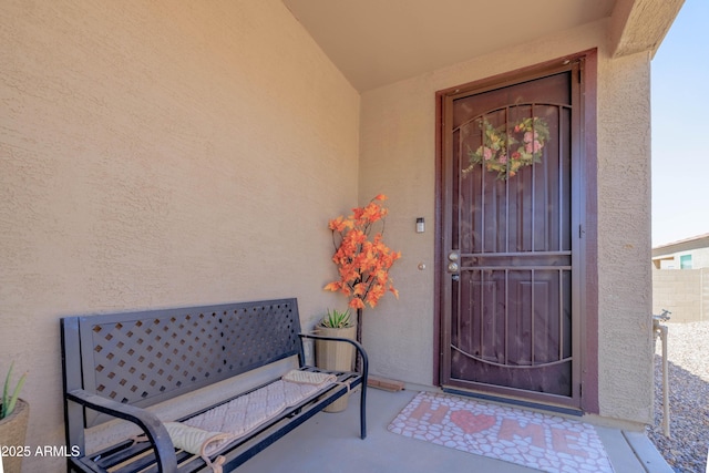 doorway to property with stucco siding