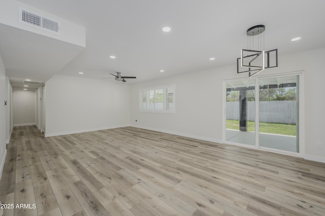 8955 W Monterey Way, Phoenix, AZ 85037 - unfurnished living room featuring light wood finished floors, recessed lighting, baseboards, and ceiling fan