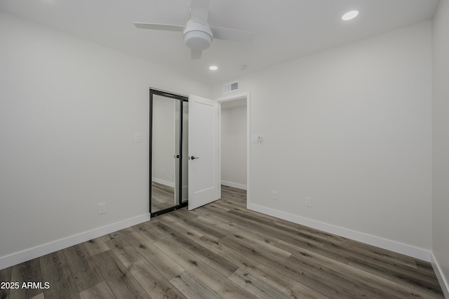 8955 W Monterey Way, Phoenix, AZ 85037 - unfurnished room with recessed lighting, a ceiling fan, baseboards, and wood finished floors