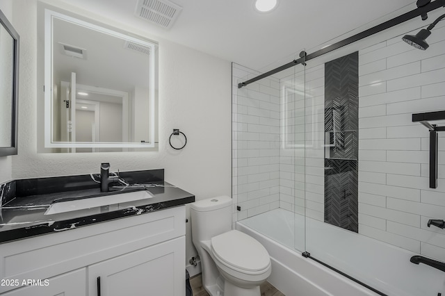 8955 W Monterey Way, Phoenix, AZ 85037 - full bathroom featuring toilet, vanity, and shower / bath combination with glass door