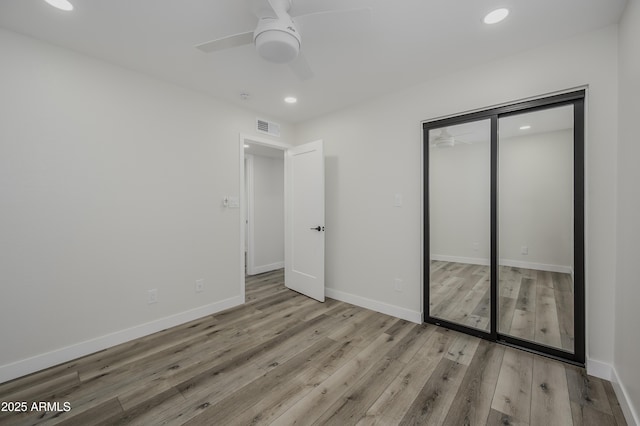8955 W Monterey Way, Phoenix, AZ 85037 - unfurnished bedroom with recessed lighting, wood finished floors, a closet, baseboards, and a ceiling fan