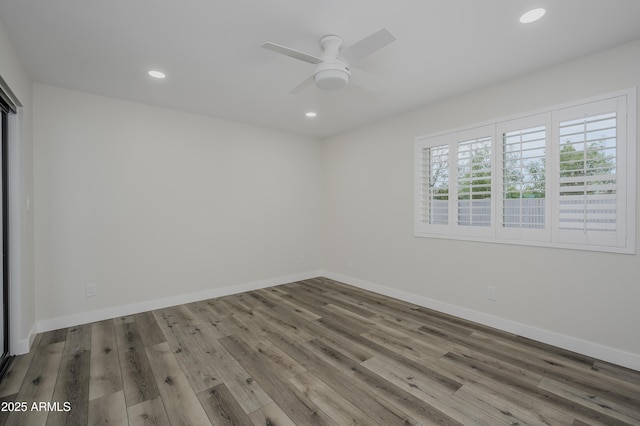 8955 W Monterey Way, Phoenix, AZ 85037 - unfurnished room with wood finished floors, recessed lighting, ceiling fan, and baseboards