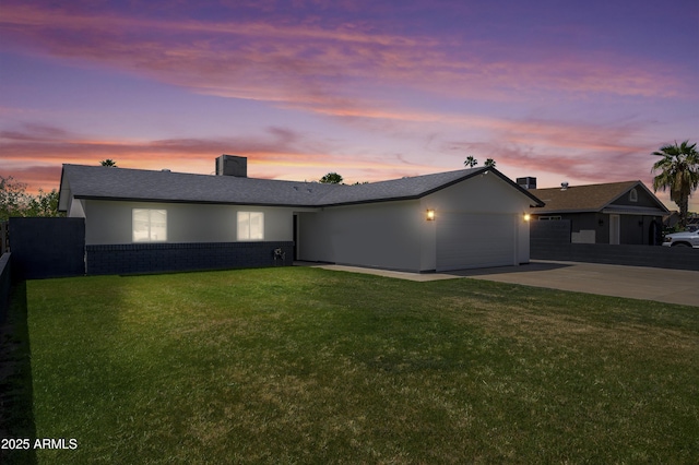 8955 W Monterey Way, Phoenix, AZ 85037 - single story home with driveway, an attached garage, and a chimney