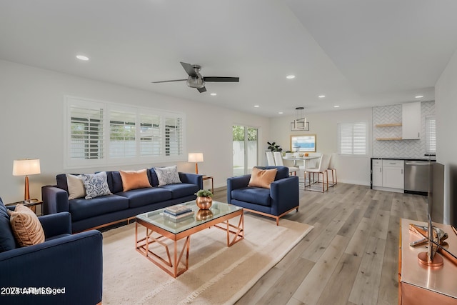 8955 W Monterey Way, Phoenix, AZ 85037 - living room with light wood-style floors, healthy amount of natural light, recessed lighting, and ceiling fan