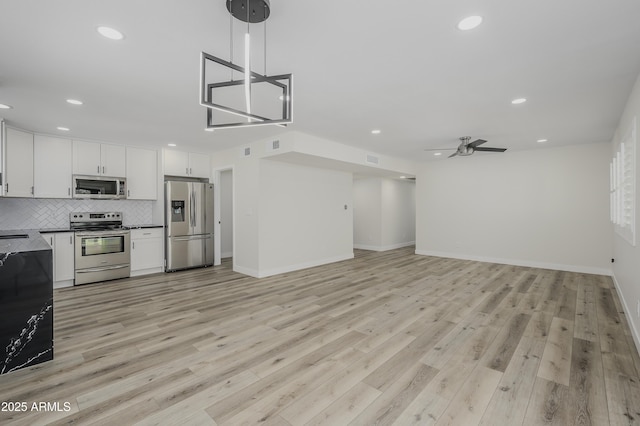 8955 W Monterey Way, Phoenix, AZ 85037 - kitchen featuring stainless steel appliances, dark countertops, recessed lighting, ceiling fan, and tasteful backsplash