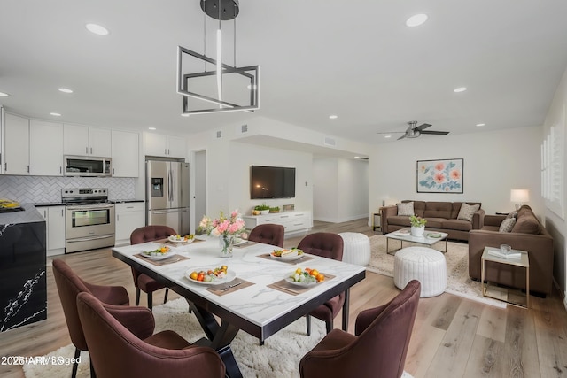 8955 W Monterey Way, Phoenix, AZ 85037 - dining space featuring light wood-style flooring, recessed lighting, and a ceiling fan