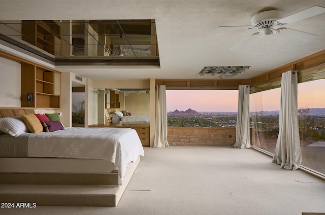 bedroom featuring carpet, ceiling fan, and access to exterior