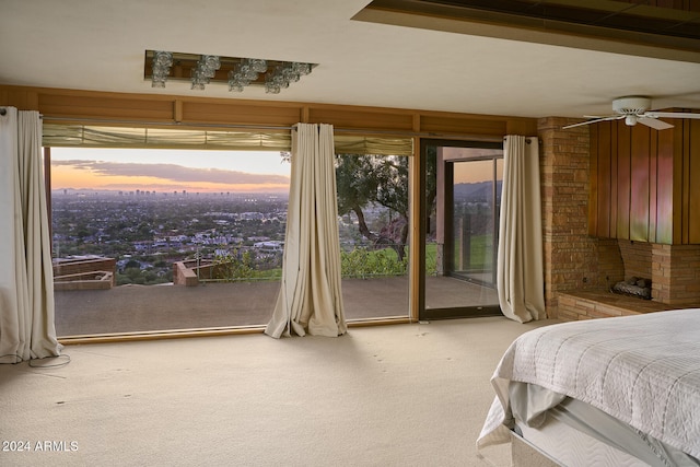 bedroom with ceiling fan, light carpet, and access to outside