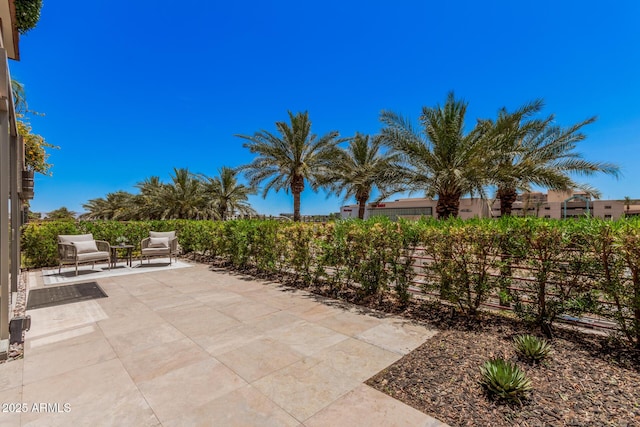 view of patio featuring fence