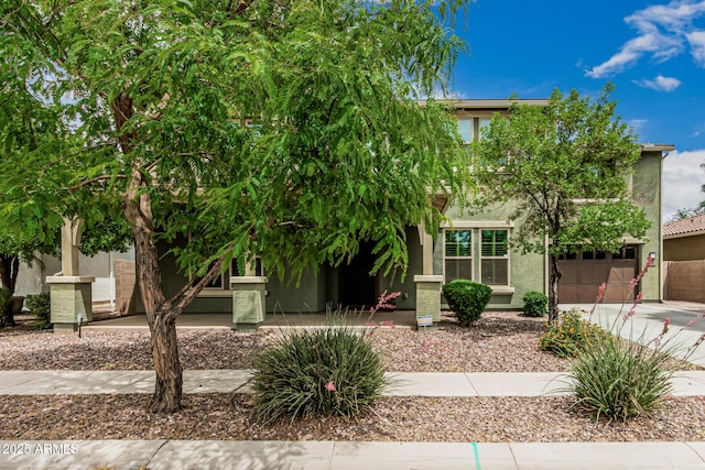 1915 S Ponderosa Dr, Gilbert, AZ 85295 - obstructed view of property featuring stucco siding, driveway, and a garage