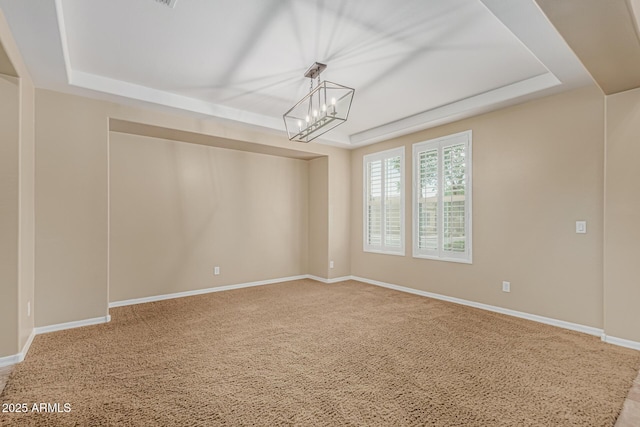 1915 S Ponderosa Dr, Gilbert, AZ 85295 - empty room featuring a raised ceiling, carpet floors, a chandelier, and baseboards