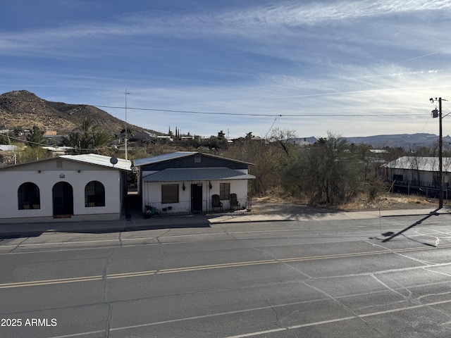 view of front of property with a mountain view