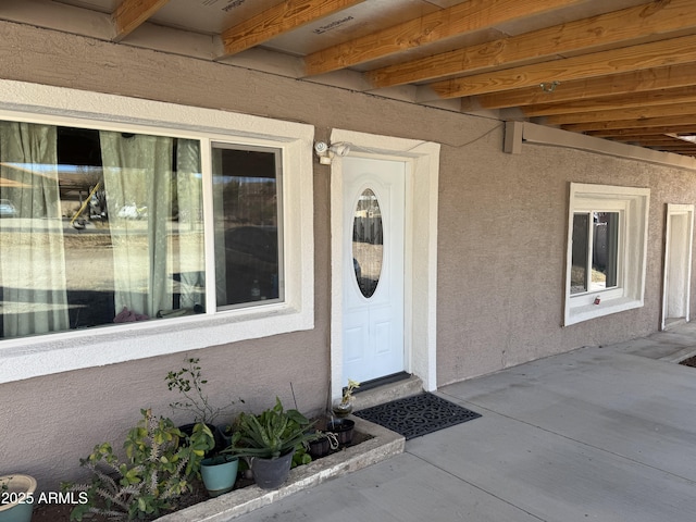 doorway to property with a patio area