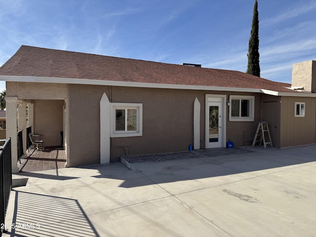 rear view of house featuring a patio