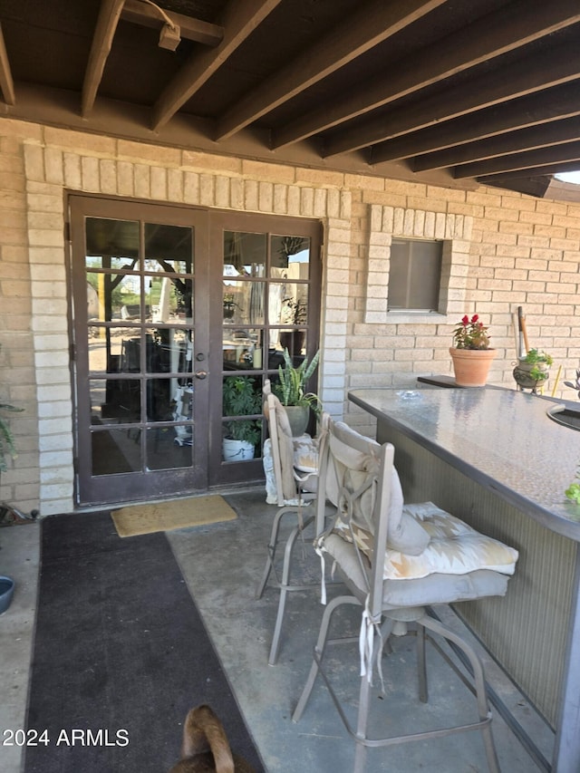 view of patio with outdoor dining area and french doors