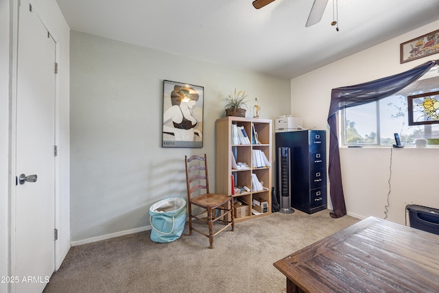 office space featuring ceiling fan, carpet flooring, and baseboards