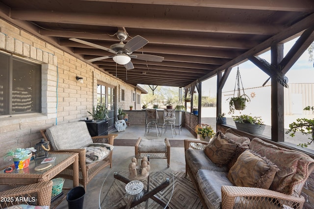 view of patio / terrace featuring an outdoor hangout area, outdoor dining area, and a ceiling fan