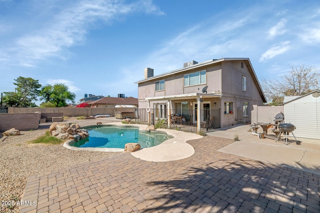 view of pool with a patio, a fenced in pool, and a fenced backyard