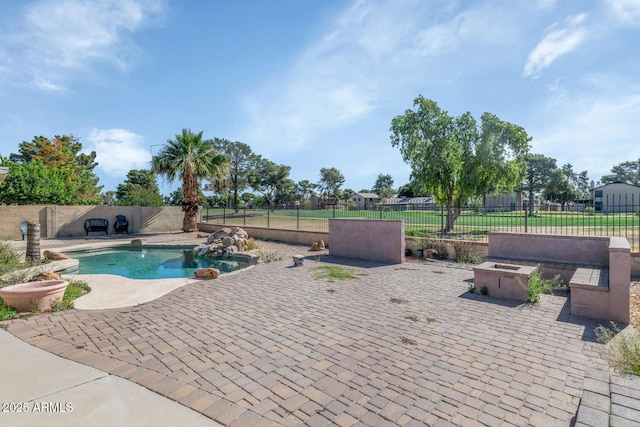 view of swimming pool featuring a patio and a fenced backyard