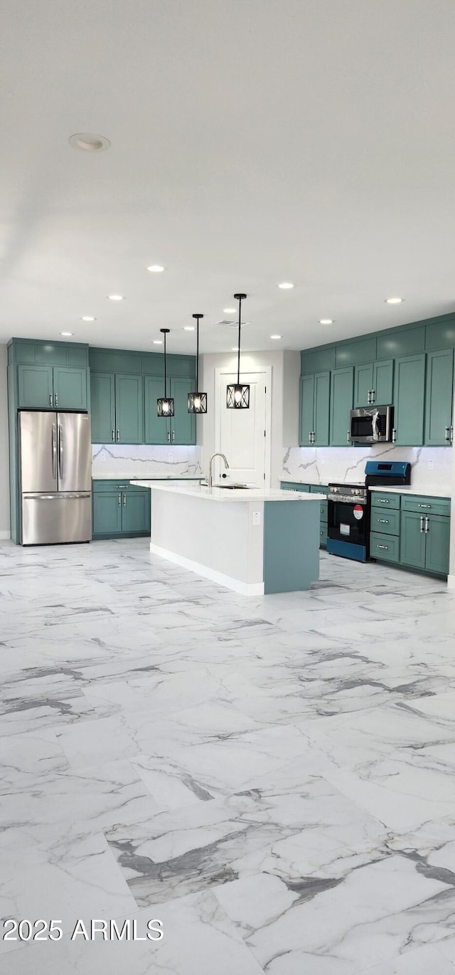 kitchen featuring pendant lighting, sink, stainless steel appliances, and green cabinetry