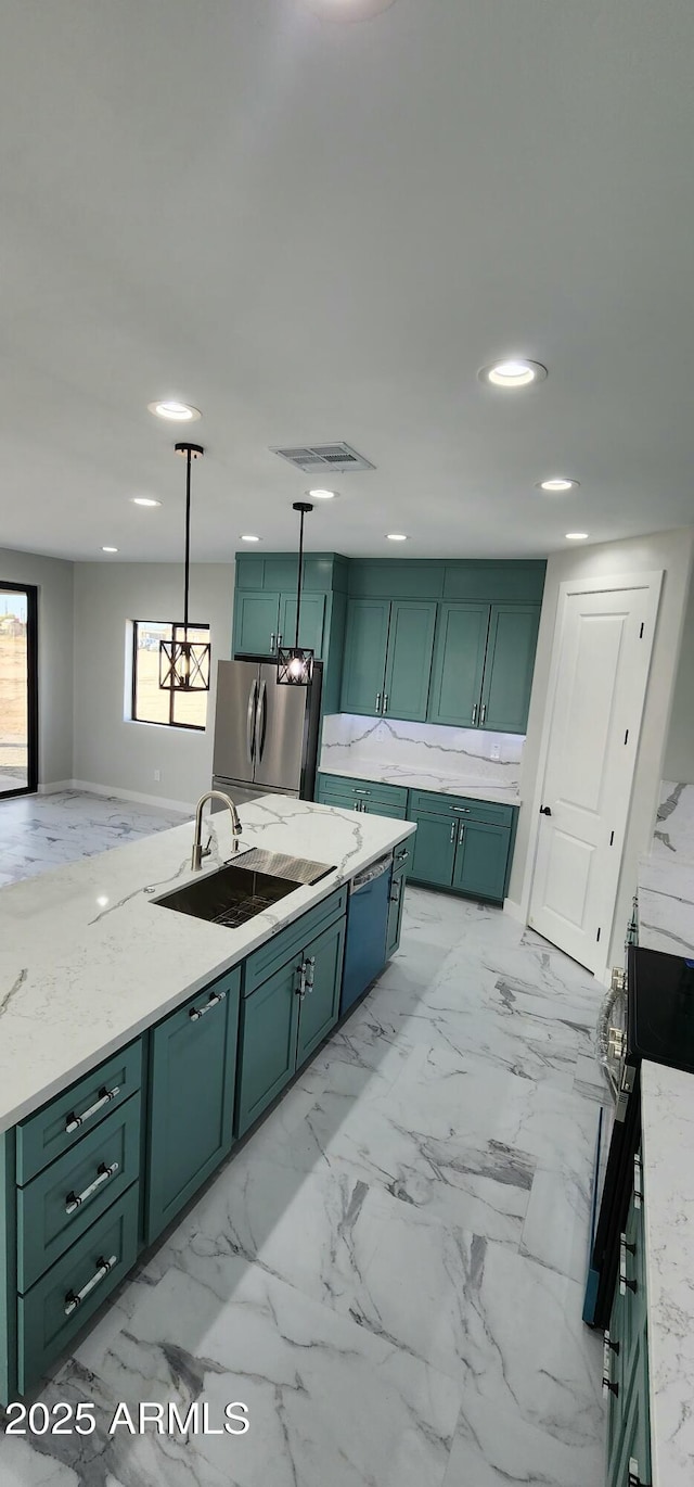 kitchen featuring stainless steel refrigerator, green cabinetry, electric stove, and light stone countertops