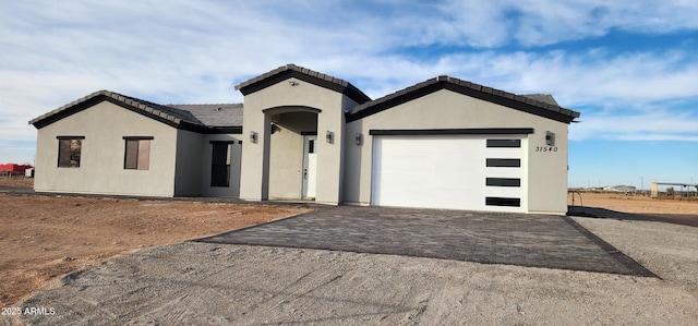 view of front of property with a garage