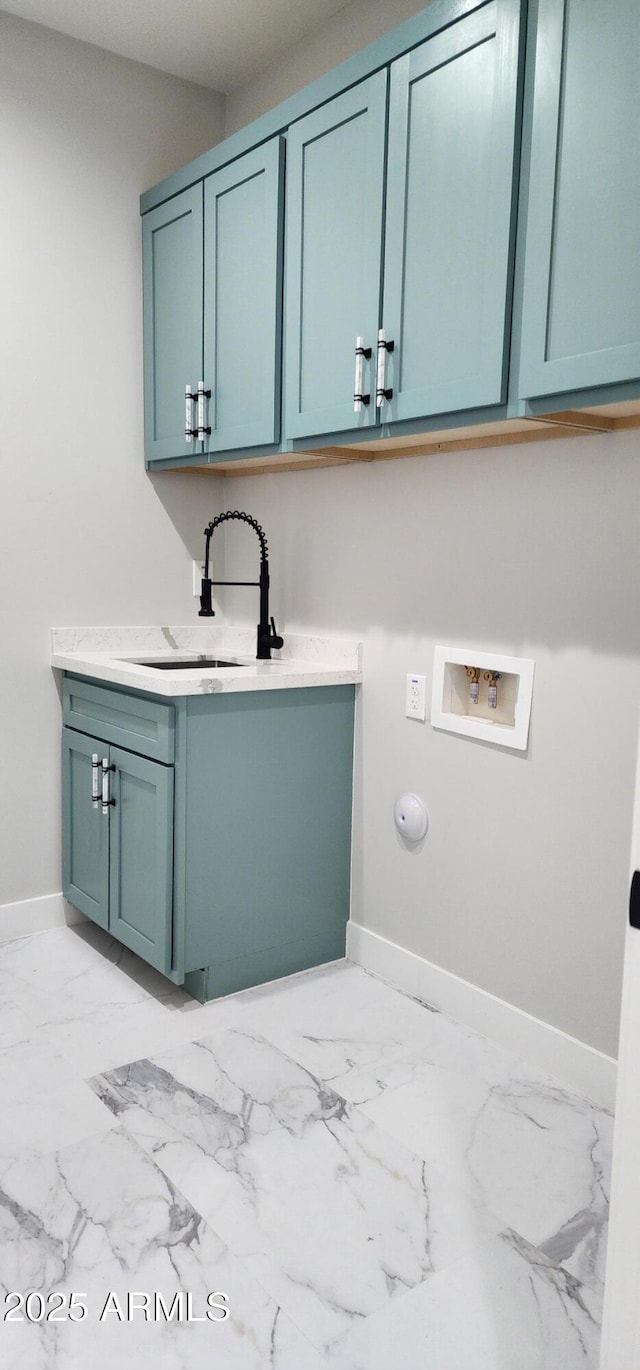 laundry area featuring washer hookup, sink, and cabinets