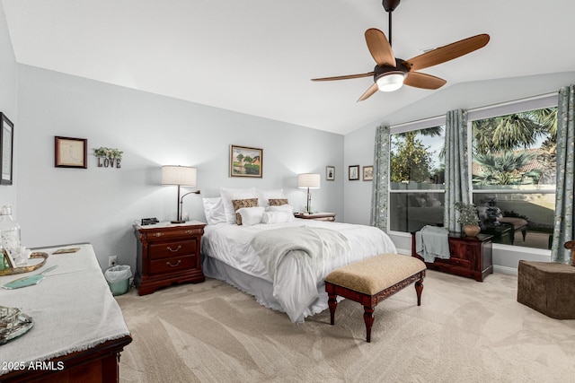 carpeted bedroom with ceiling fan and lofted ceiling