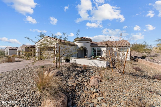 mediterranean / spanish house with a garage