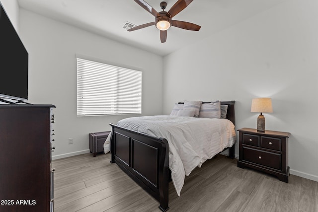 bedroom with ceiling fan and light wood-type flooring