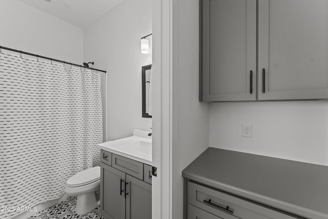 bathroom featuring vanity, a shower with curtain, and toilet