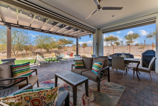 view of patio / terrace with area for grilling, a pergola, outdoor lounge area, and ceiling fan