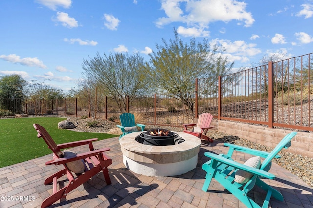 view of patio with a fire pit