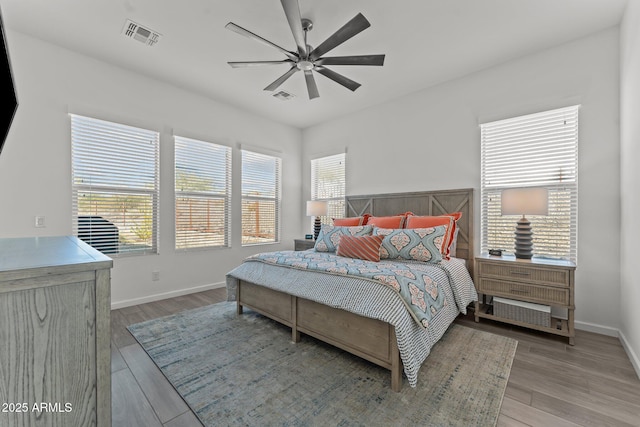 bedroom featuring hardwood / wood-style flooring and ceiling fan