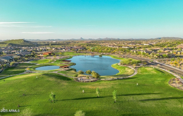 drone / aerial view with a water and mountain view