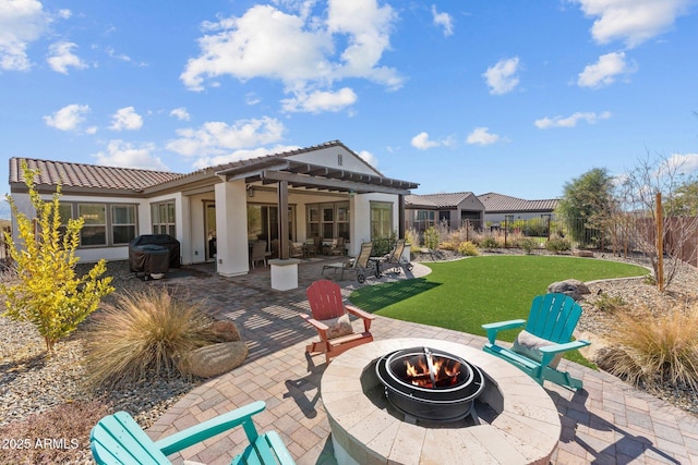 view of patio / terrace featuring an outdoor fire pit, a pergola, and a grill