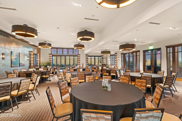 dining space with light colored carpet