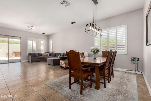 3824 E Parkside Ln, Phoenix, AZ 85050 - dining area with baseboards, ceiling fan, and light tile patterned floors