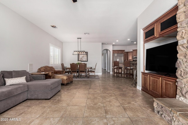 3824 E Parkside Ln, Phoenix, AZ 85050 - living area featuring recessed lighting, light tile patterned floors, and arched walkways
