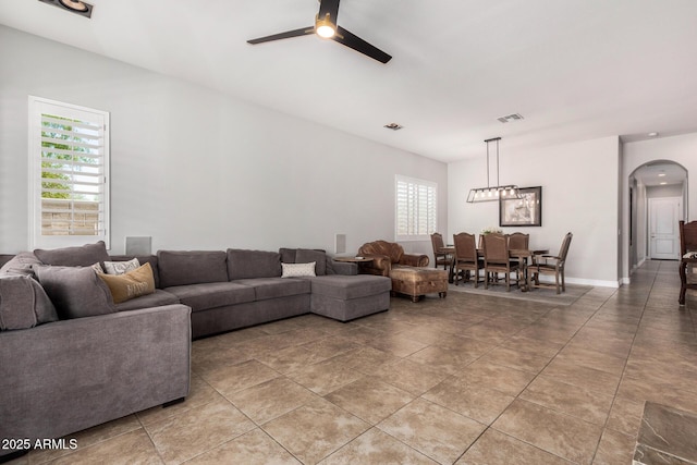 3824 E Parkside Ln, Phoenix, AZ 85050 - living area with arched walkways and ceiling fan
