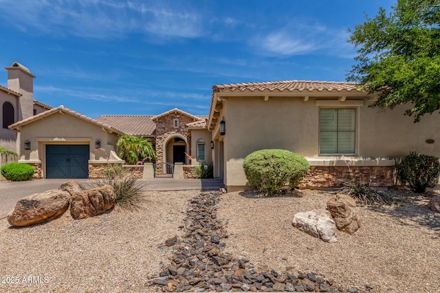 3824 E Parkside Ln, Phoenix, AZ 85050 - mediterranean / spanish home featuring stucco siding, an attached garage, stone siding, and driveway